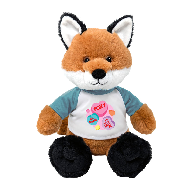 Plush fox toy with a shirt displaying heart-shaped text on a white background