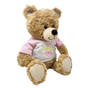 Angled front view of teddy bear plush wearing “Birthday Girl” shirt