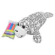 Angled view of a black and white color-me plush seal with printed designs and text, shown with a pack of colorful markers, on a white background.