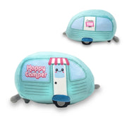 A soft plush toy resembling a blue and green camper with a 'Happy Camper' text and a cute face on the front.