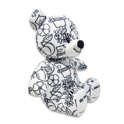 Angled view of a black and white Georgia-themed teddy bear plush with bees, flowers, peaches, and “Georgia” text printed across the fabric, featuring “My name is” and “I was born on” text on the feet, on a white background.