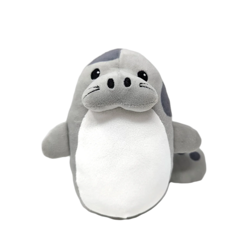 A gray and white manatee plush toy with a cute face and a mustache.
