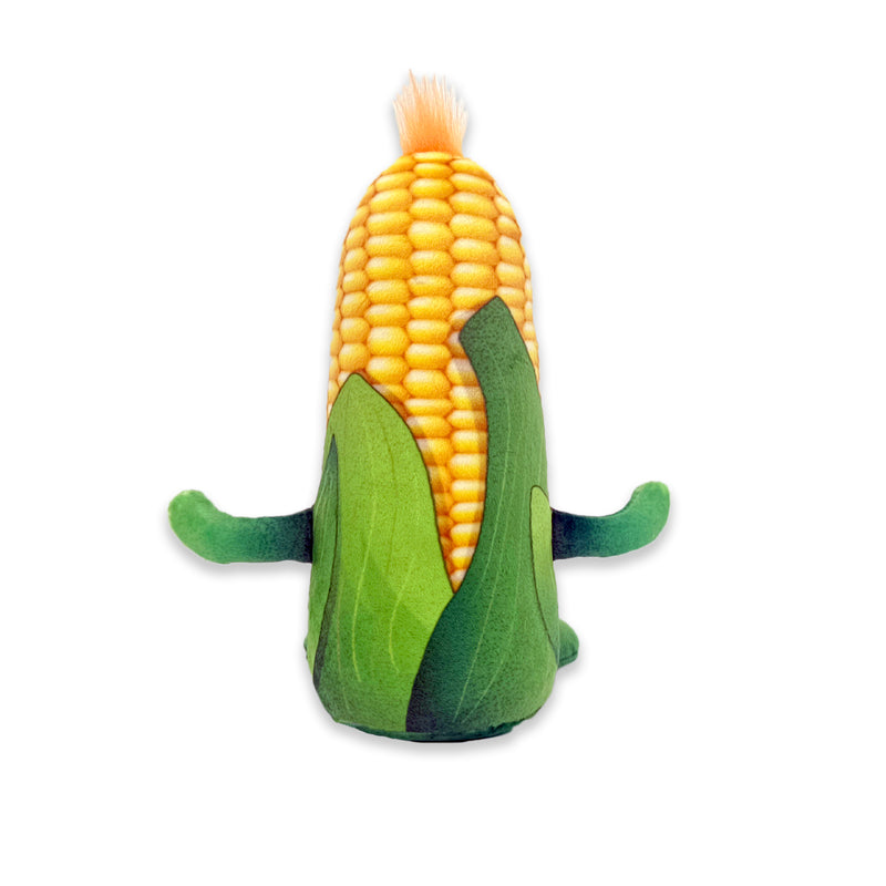 Back view of a plush corn cob toy with yellow kernels, green husk leaves, small green arms, and a tan tassel on top against a white background.