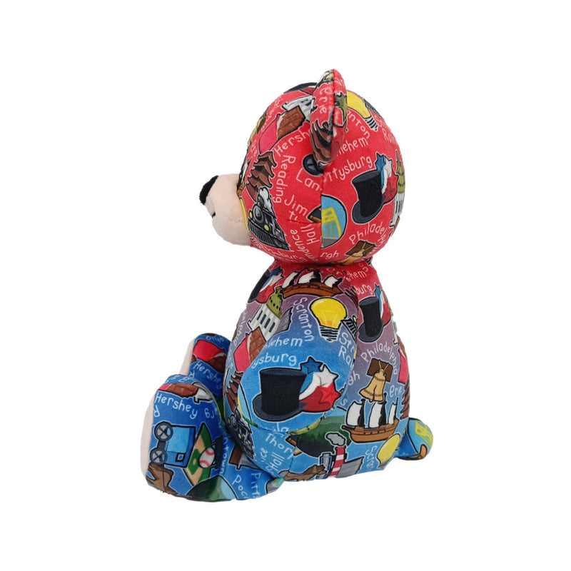 Side view of Colorful teddy bear with a patterned design on a white background