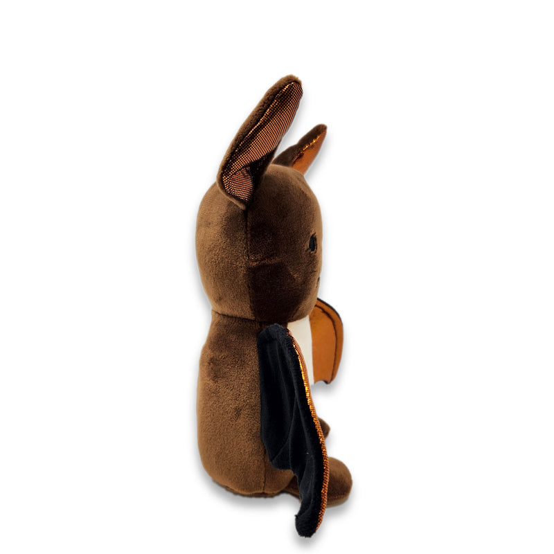 Side view of a Brown bat plush with metallic copper wings, tan belly, pointed ears, and small white fangs.