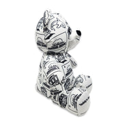 Side view of a white teddy bear plush covered in black California Republic illustrations, with text on the feet reading “Teddy’s Name” and “Colored On.”