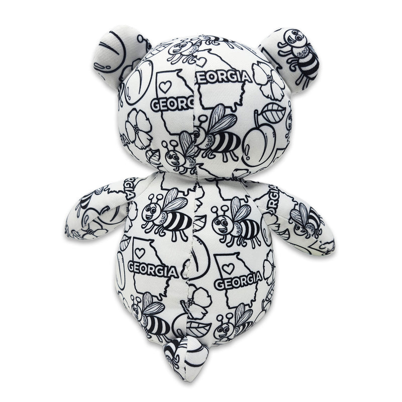 Back view of a black and white Georgia-themed teddy bear plush with bees, flowers, peaches, and “Georgia” text printed across the fabric, featuring “My name is” and “I was born on” text on the feet, on a white background.