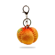 Back view of pumpkin plush keychain