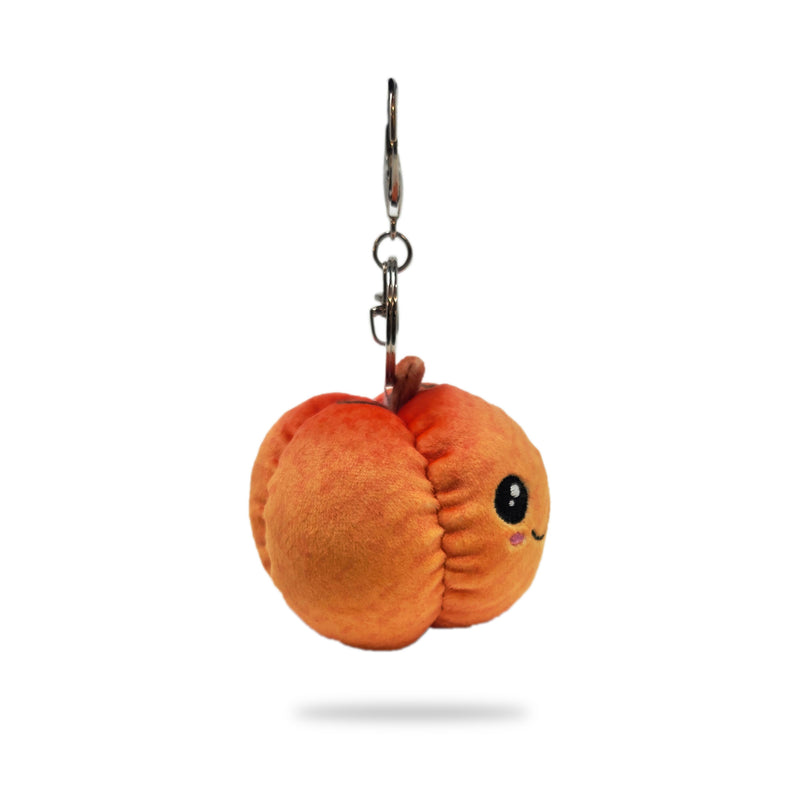 Side view of pumpkin plush keychain