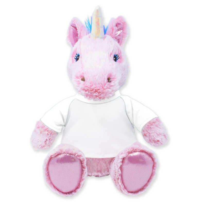 Front view of a pink plush unicorn with a rainbow horn, blue embroidered eyes, shiny pink inner ears, wearing a plain white shirt with gray patterned sleeves, and sitting upright with pink textured feet.