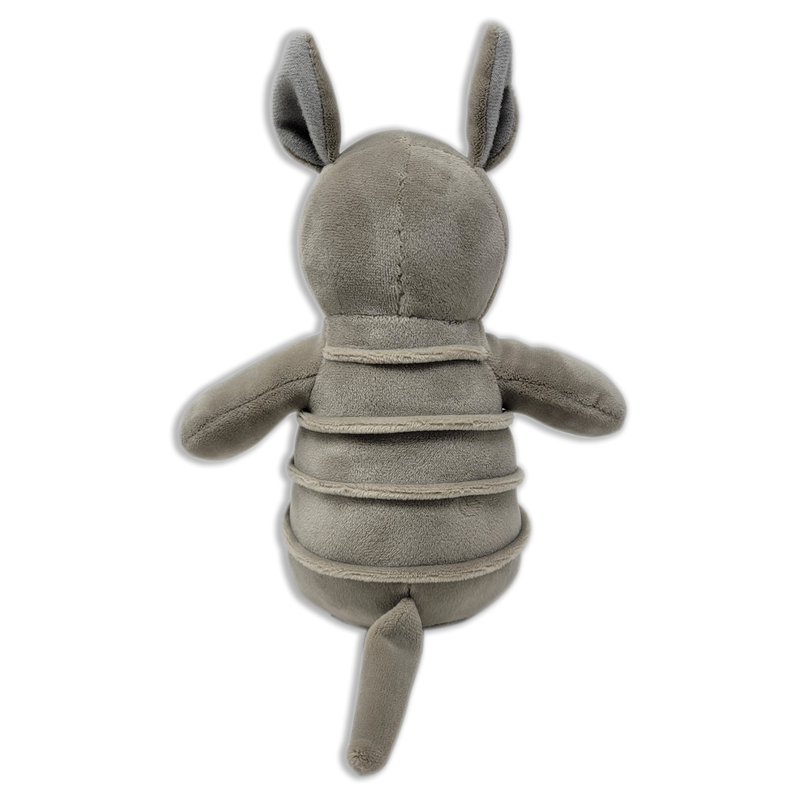 Back view of a gray plush armadillo with upright ears, segmented body bands, short arms, and a long tail on a transparent background.
