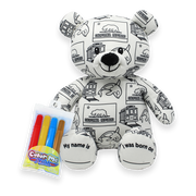 Front view of a white teddy bear plush covered in black California-themed illustrations, with a Color Me Plush marker pack shown beside it and text on the feet reading “My name is” and “I was born on.”