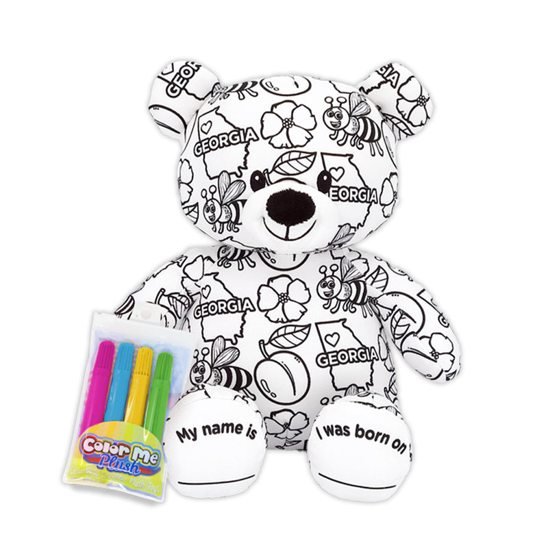 A plush teddy bear with 'Georgia' printed on its fabric, along with icons such as a state outline, a bumblebee, a peach, and a Cherokee Rose flower. It is accompanied by a pack of colorful markers.