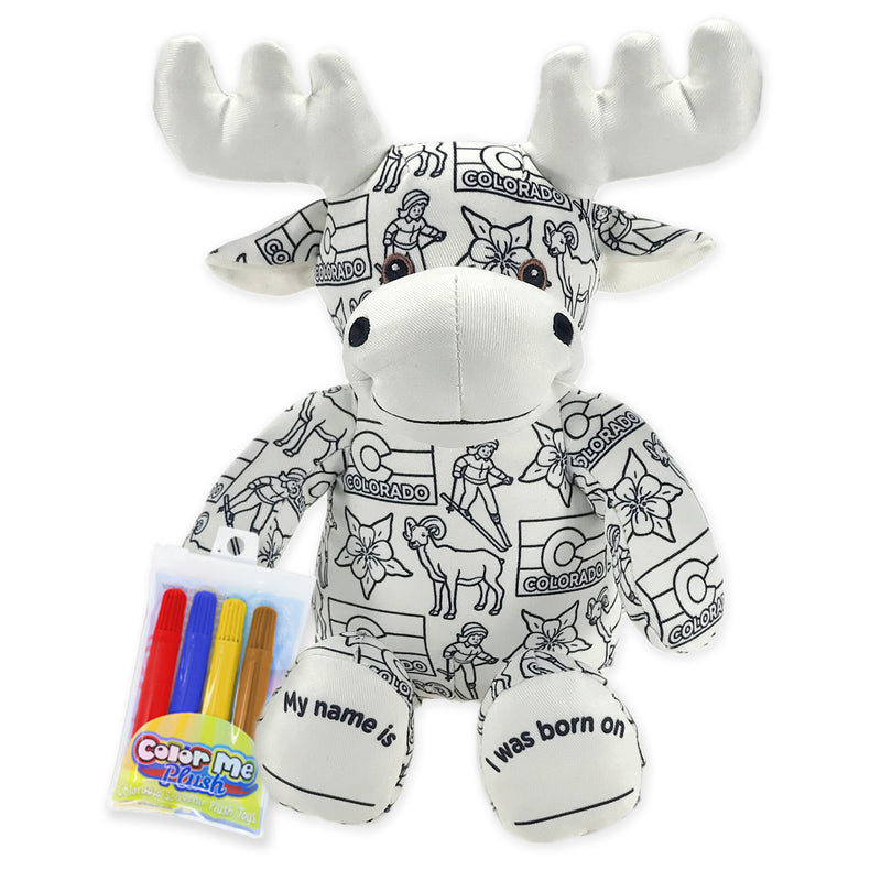 Front view of a black-and-white colorable plush moose with Colorado-themed illustrations, blank name and birth date feet, and a pack of four washable markers beside it.