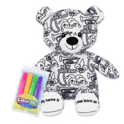 A plush teddy bear with New Orleans themed print, including Mardi Gras beads and a trumpet, accompanied by a pack of colorful markers.