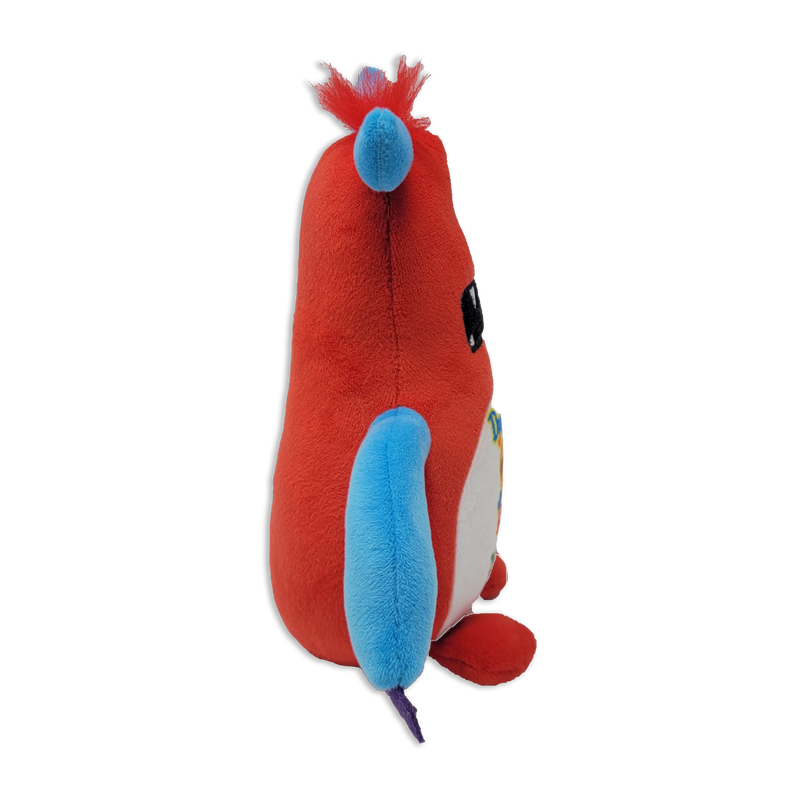 Side view of a red monster plush toy with a blue ear, blue arm, purple tail tip, fuzzy red tuft on top, and rounded body on a transparent background.