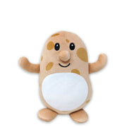 A plush toy resembling a potato with a smiling face, white belly, and brown spots.