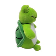 Side view of a green plush turtle with a light green belly, stitched smiling mouth, rounded arms and legs, and a darker green shell with stitched segments on a transparent background.