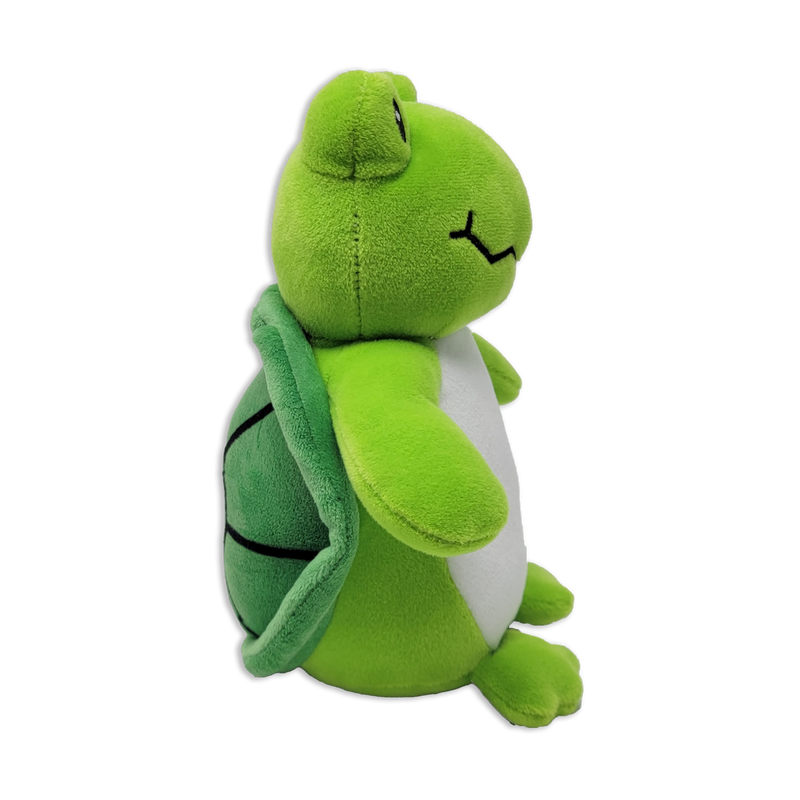 Side view of a green plush turtle with a light green belly, stitched smiling mouth, rounded arms and legs, and a darker green shell with stitched segments on a transparent background.