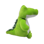 Side view of a green dinosaur plush toy with a long snout, white belly, rounded arms, small feet, and soft ridged spikes along the back on a transparent background.