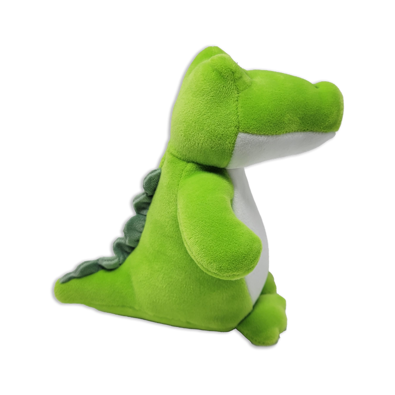 Side view of a green dinosaur plush toy with a long snout, white belly, rounded arms, small feet, and soft ridged spikes along the back on a transparent background.