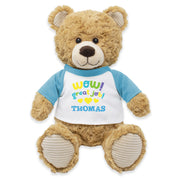 A plush teddy bear wearing a white shirt with a blue and yellow bow tie, and the text 'WOW! GREAT JOB, THOMAS!' printed on it.