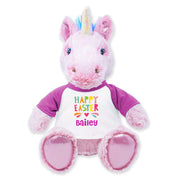 A 9-inch plush unicorn toy with a pink body, purple sash, and a unicorn horn, designed for cuddling.